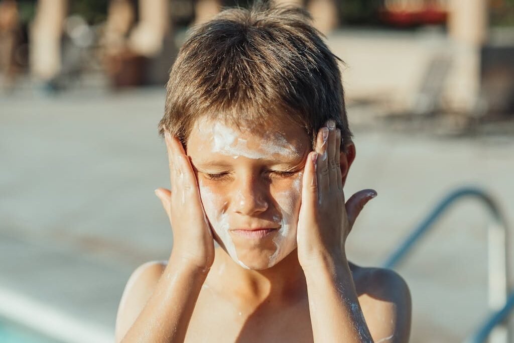 A Boy with Sunscreen on His Face